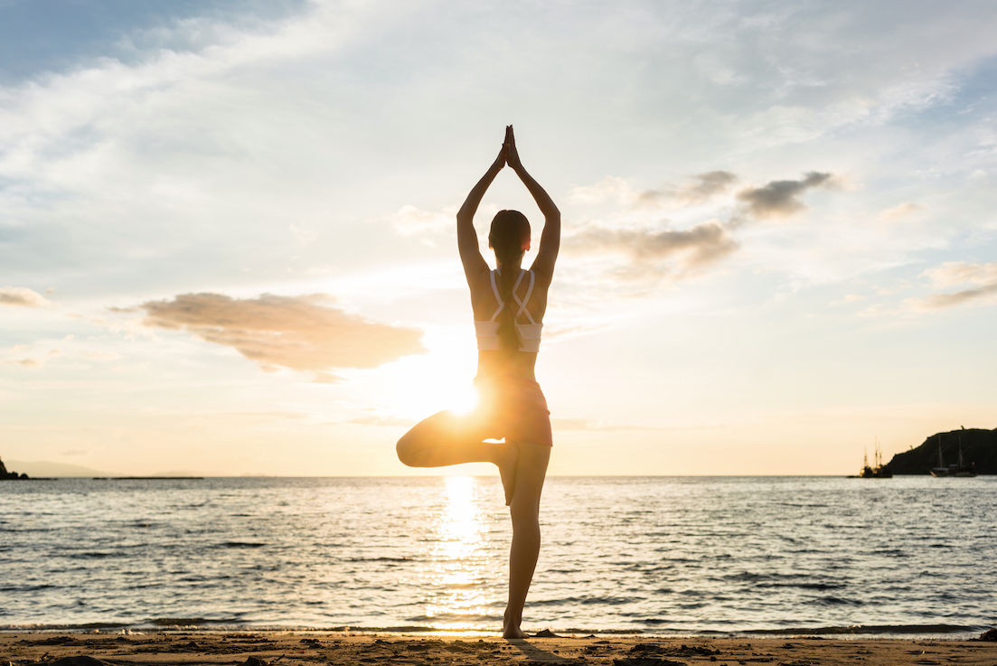 Yoga poses at sunset background Royalty Free Vector Image
